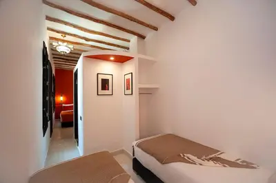 a bedroom with two beds in a room at Riad Mylaya in Marrakech