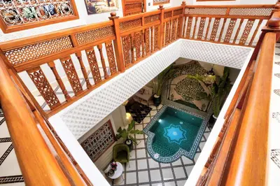 an overhead view of a house with a swimming pool at Riad Arabkech in Marrakech