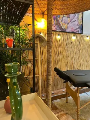 a green vase sitting on top of a table at Riad Paradise privatisé au cœur des souks in Marrakech