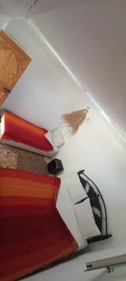a room with a staircase with a car in the ceiling at Riad chaoui house in Marrakech