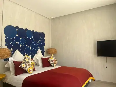 a bedroom with a bed with a balloon wall at Villa Dar Balou - FAMILY ONLY in Marrakech