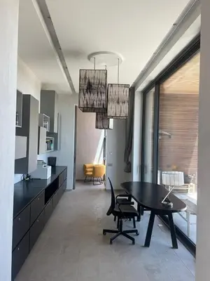 a kitchen and dining room with a table and chairs at Villa Dar Balou - FAMILY ONLY in Marrakech