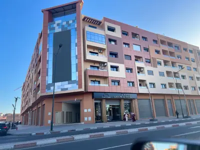 a building on the corner of a street at Luxury Apartment in the center of Gueliz Marrakech in Marrakech