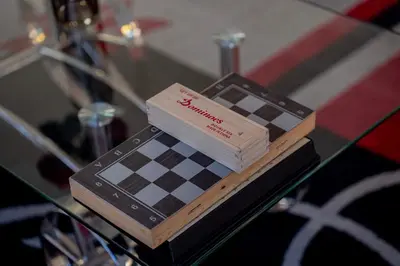 a chess board on top of a glass table at Villa Arabic House Pool & SPA, Marrakech in Marrakech