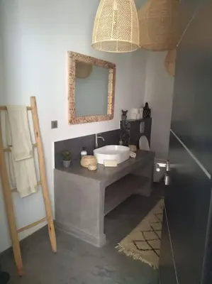 a bathroom with a sink and a mirror at Villa Le Clos de l'Atlas in Marrakech