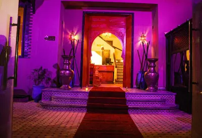 a purple room with two vases and a door at Majorel Pearl Hotel-Riad-Restaurant Piscine&Spa in Marrakech