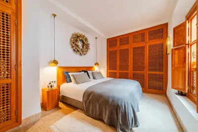 a bedroom with a bed and a window at RIAD THE MILESTONE in Marrakech