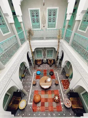 an overhead view of a building with a table and chairs at Riad Deux Palmiers in Marrakech