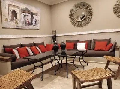 a living room with a couch and a table at Dar Nassima in Marrakech