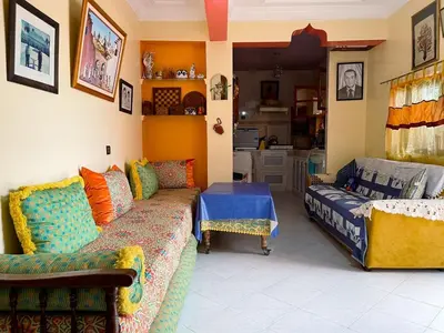 a living room with a couch and a table at Maison avec piscine et grand jardin 1 hectare in Marrakech