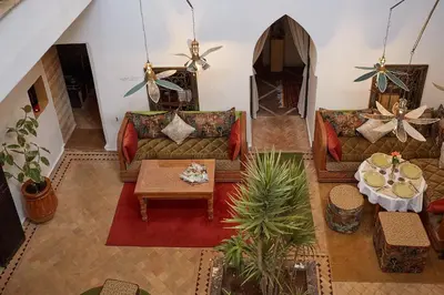 an overhead view of a living room with couches and a table at Riad Al Ibtikar in Marrakech