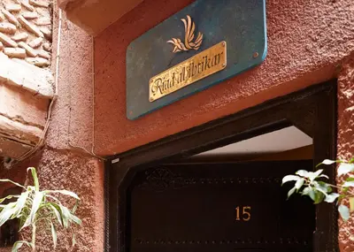 a sign on a building that says garden museum at Riad Al Ibtikar in Marrakech