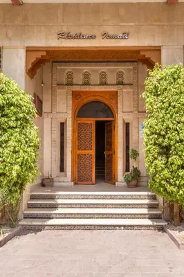 an entrance to a building with a wooden door at L'Atelier N°12, Loft, Terrasse in Marrakech
