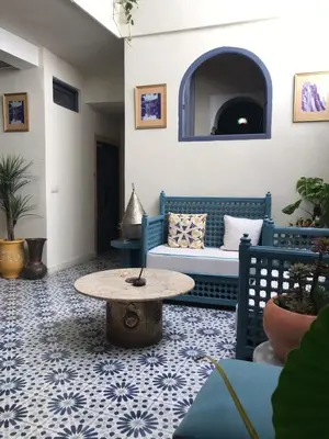 a living room with a couch and a table at Winarouze house in Marrakech