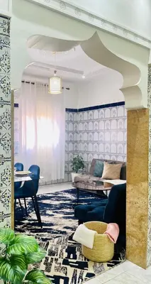 a living room with a couch and a table at Mamounia Patio & Rooftop in Marrakech
