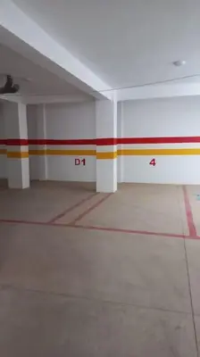 an empty room with colored stripes on the walls at Appartement cosy au cœur de Marrakech avec piscine in Marrakech