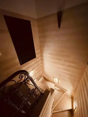 a view of a stairway with a black railing at Riad RIM in Marrakech