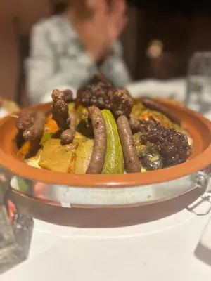 a bowl of food sitting on top of a table at Riad RIM in Marrakech