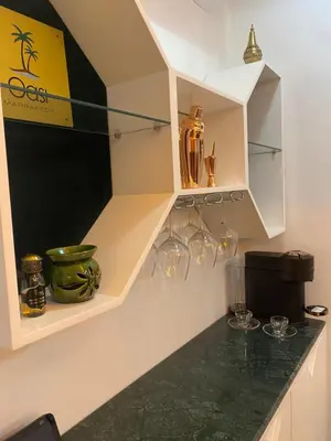 a kitchen with a counter with glassware on it at Oasi Marrakech in Marrakech