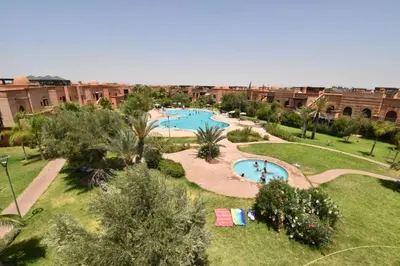 an overhead view of a resort with two swimming pools at Appart atlas resort in Marrakech