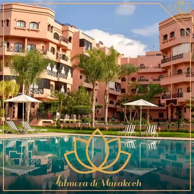 a view of the margaritaville hotel from the pool at Palmera de Marrakech in Marrakech