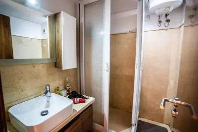 a bathroom with a sink and a shower at Apartment pool marrakech in Marrakech