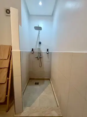 a bathroom with a shower with a shower at Cosy appartement au cœur de Gueliz in Marrakech