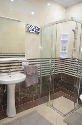 a bathroom with a sink and a shower at JHDARINNA in Marrakech