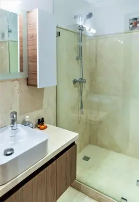 a bathroom with a sink and a shower at Royal Deluxe Diamond - Marrakech, Luxe Pool View in Marrakech