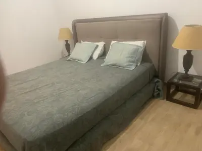 a bedroom with a bed with two pillows on it at Family apart in Marrakech