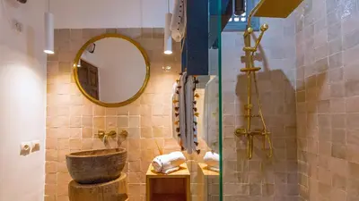 a bathroom with a sink and a mirror at RIAD 48 & SPA in Marrakech