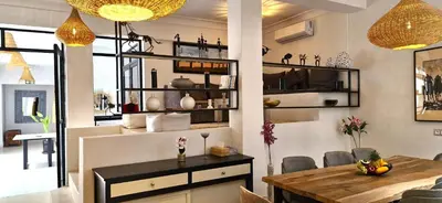 a kitchen and dining room with a dining table and a dining room at RIAD 48 & SPA in Marrakech