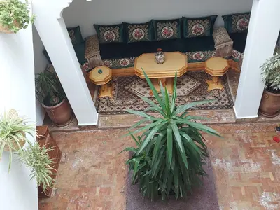 an overhead view of a patio with a table and chairs at Riad dar Karam in Marrakech