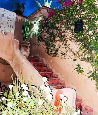 a painting of stairs with flowers and plants at Maison ALPHEA SPA HAMMAM in Marrakech