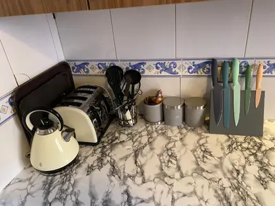 a counter top with utensils and utensils at Appartment Zaina in Marrakech