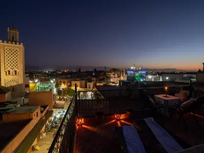 a view of a city at night at Dar Ben Saleh in Marrakech