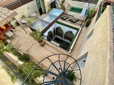 an overhead view of a patio with a swimming pool at Riad privatisé Magnolia in Marrakech