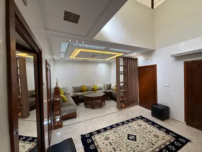 a living room with a couch and a table at Dar Chrif in Marrakech