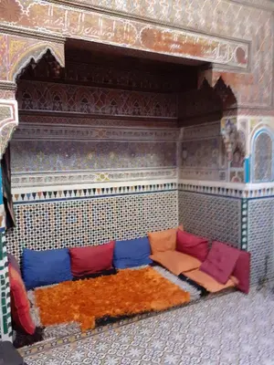 a living room with a couch in a room at Maison authentique centre médina in Marrakech