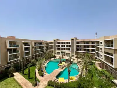 an aerial view of an apartment complex with a swimming pool at pearl garden marrakech in Marrakech