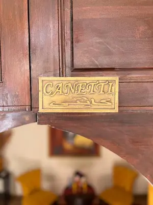 a wooden drawer with a brass latch on a wooden cabinet at Riad Sassa Finda in Marrakech