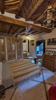 a bedroom with a large bed in a room at Beldi Riad in Marrakech