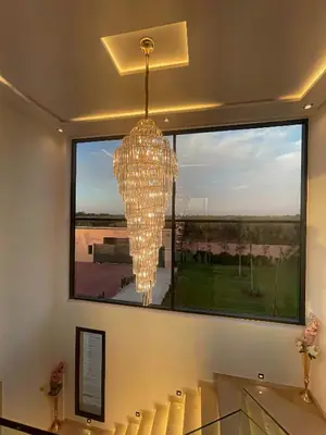 a chandelier in a room with a large window at Villa 7palms in Marrakech