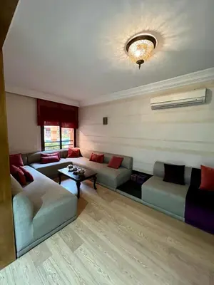 a living room with a couch and a table at Appartement chambre salon a l'hivernage 9 in Marrakech