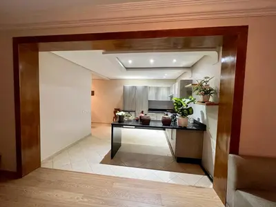 a room with a kitchen with a table in it at Appartement chambre salon a l'hivernage 9 in Marrakech