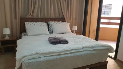a bedroom with a bed with two towels on it at Apparemment wafaa in Marrakech