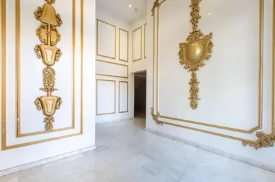a hallway with gold decorations on the walls at NEW! Luxe et moderne en plein Guéliz, Terrasse in Marrakech
