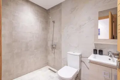 a bathroom with a shower and a toilet and a sink at NEW! Luxe et moderne en plein Guéliz, Terrasse in Marrakech