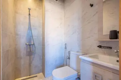 a bathroom with a shower and a toilet and a sink at NEW! Luxe et moderne en plein Guéliz, Terrasse in Marrakech
