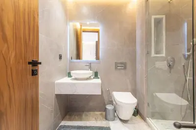 a bathroom with a sink and a toilet and a shower at New ! Stunning and Comfortable apartement in Marrakech